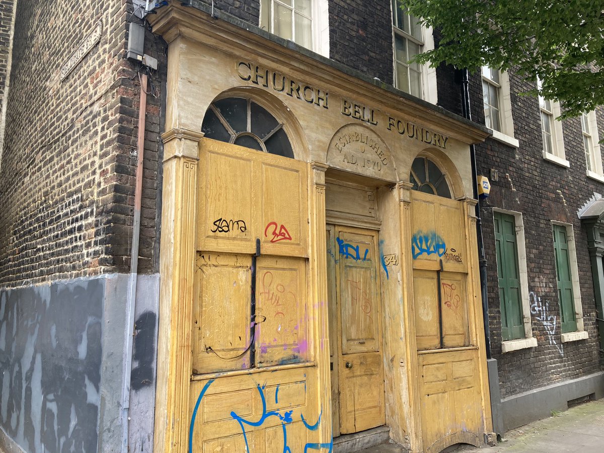 A building with graffiti on the front Description automatically generated
