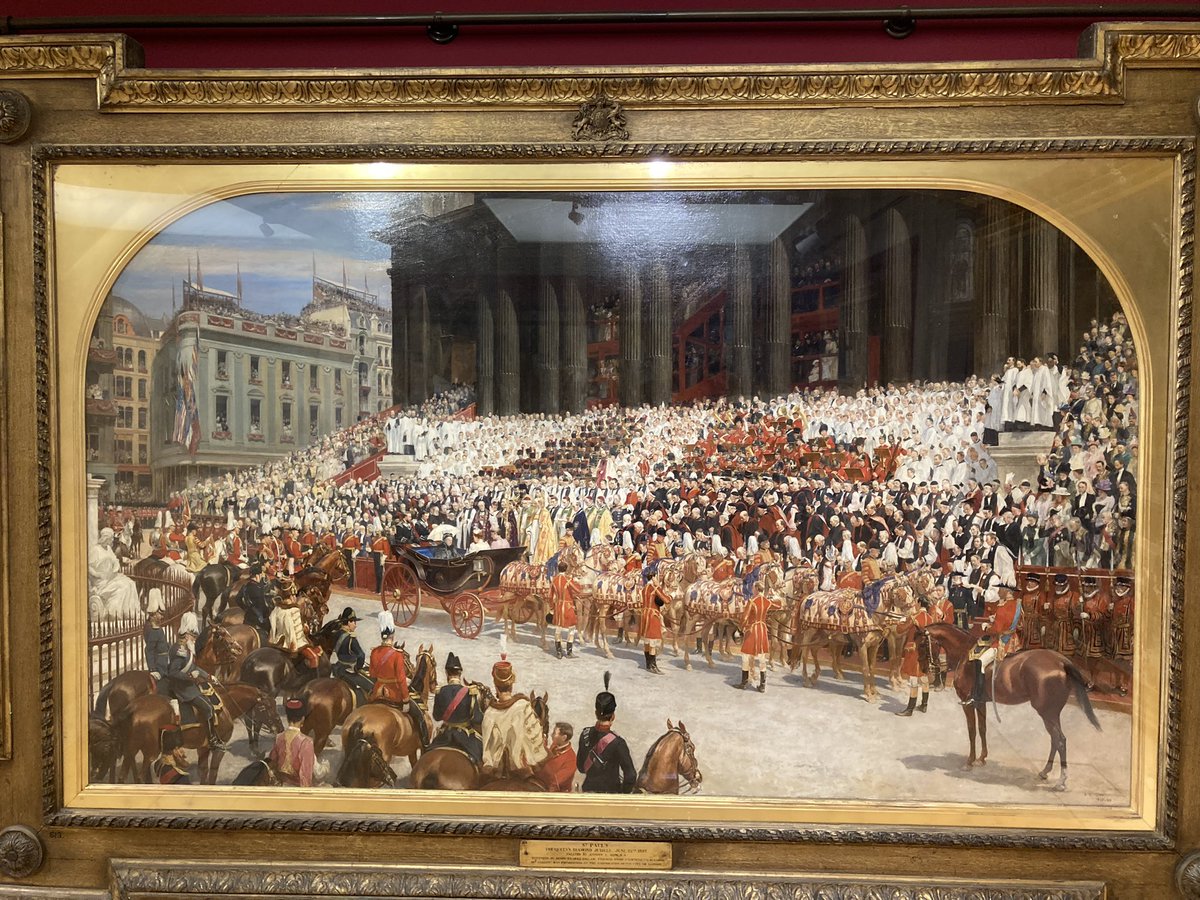 A painting of a crowd of people in a gold frame Description automatically generated