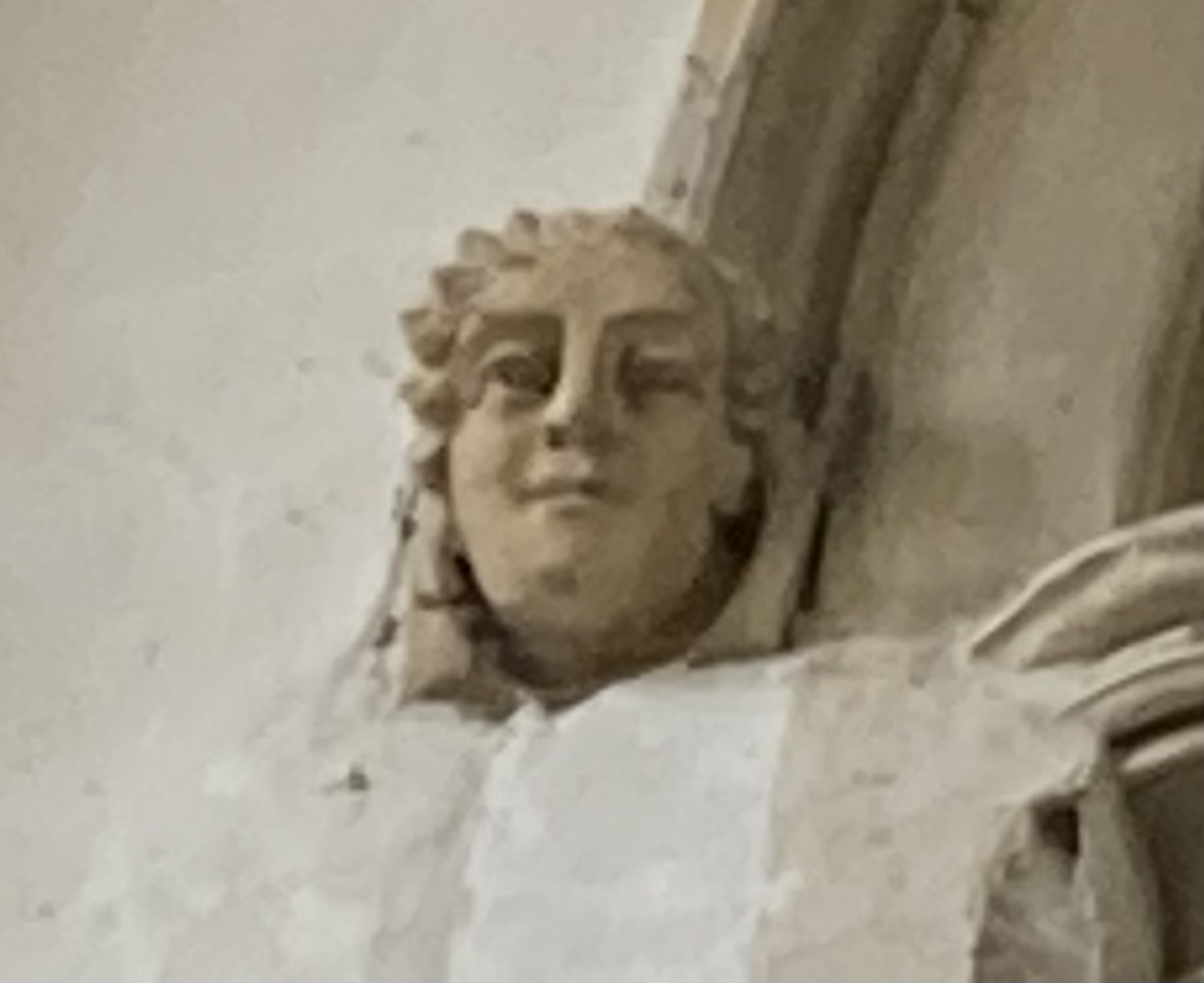 A statue of a person's face Description automatically generated