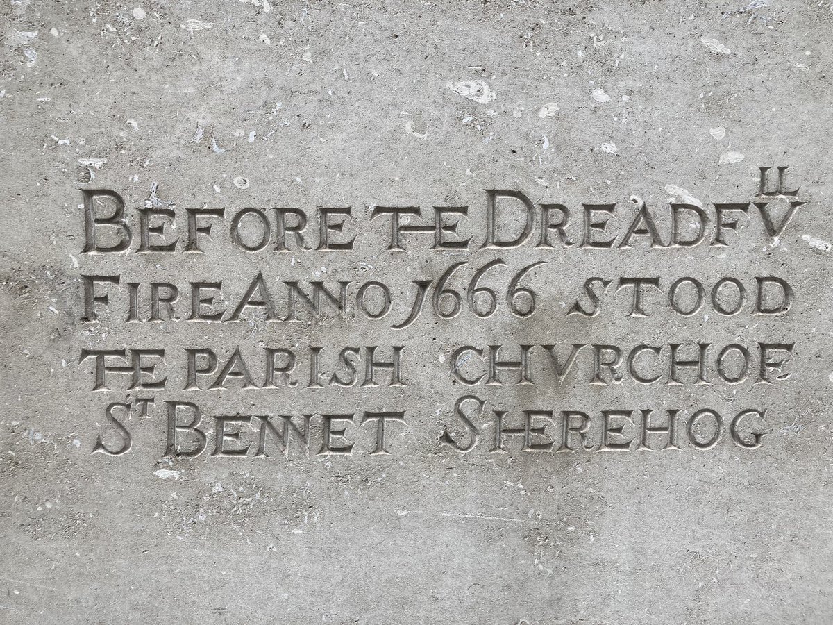 A stone with writing on it Description automatically generated